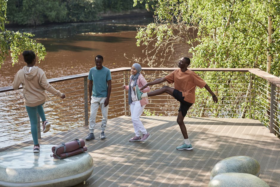 A group of friends enjoy exercising together on a sunny outdoor deck.